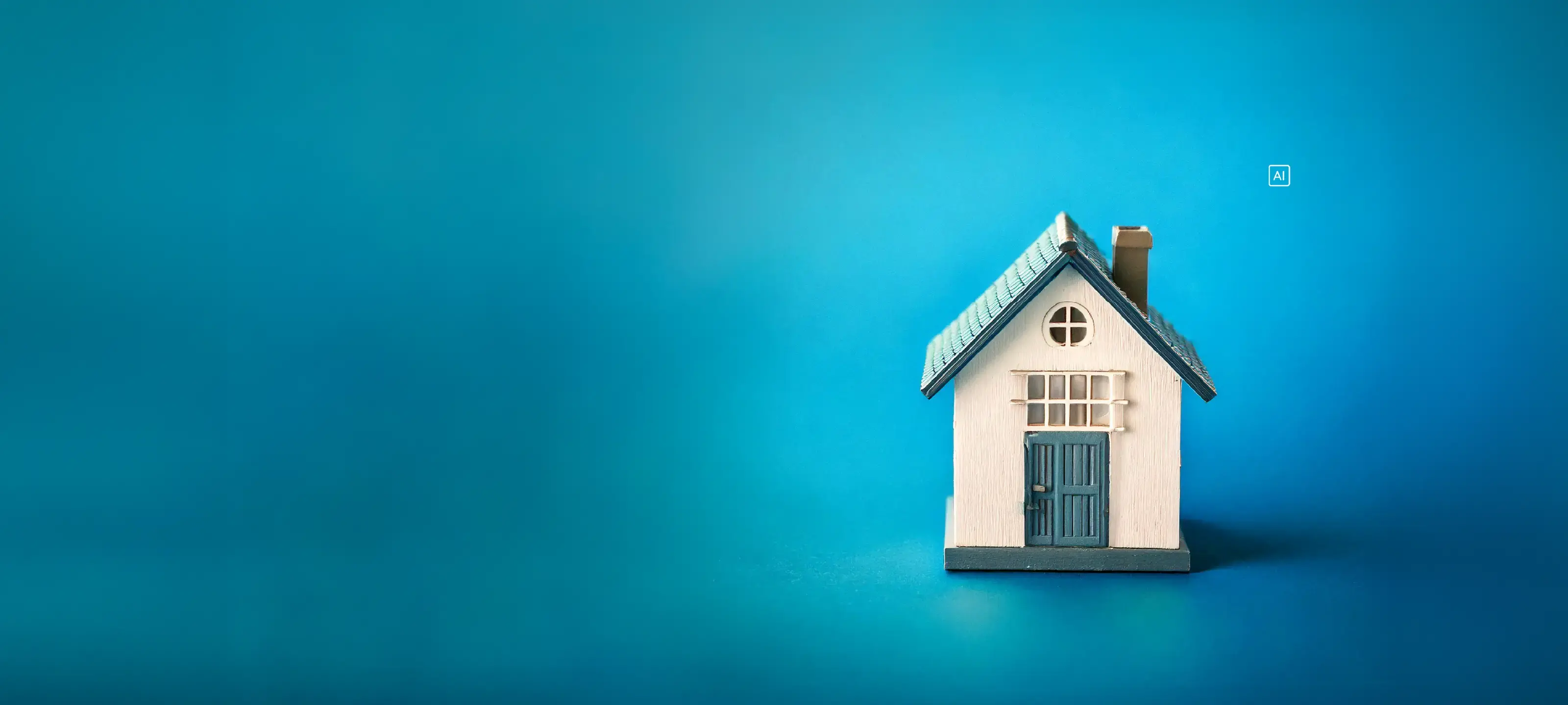 Small model house with a blue roof and door against a vibrant blue background.